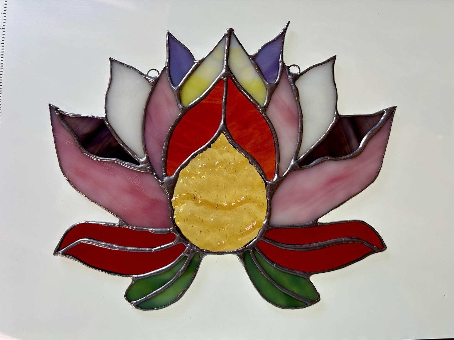 Another view of the same lotus, showing its layered petals and glass textures.