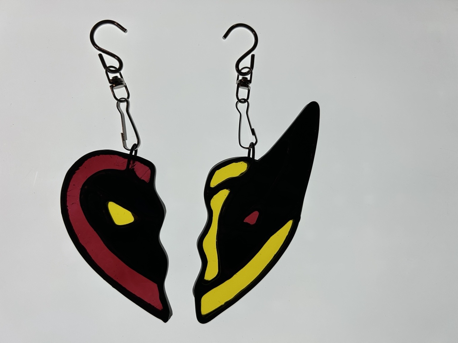 The same pair photographed with light passing through the red and yellow glass.